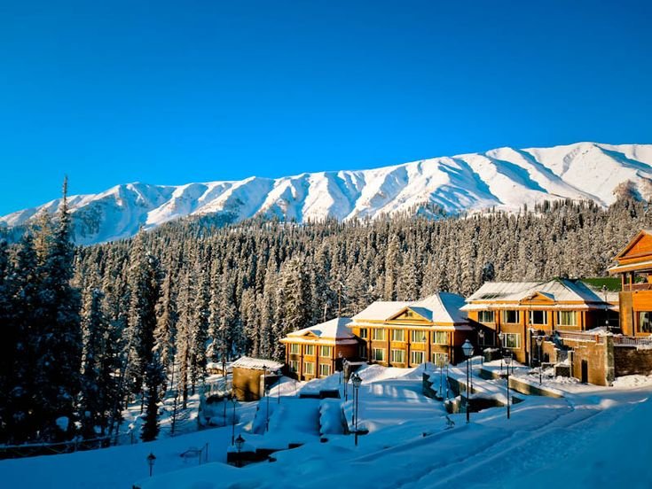 Snow-covered slopes near a luxury resort in Gulmarg